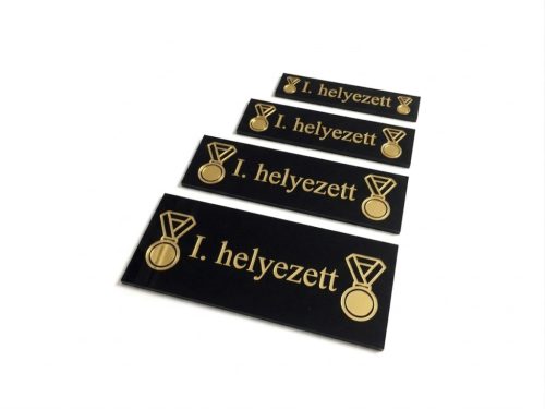 Matrica /fekete-arany/ /téglalap alakú/ /éremre/ /18mm széles/